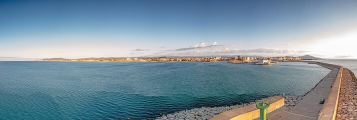 Drone panorama of the Spanish town of Vinaros with the large breakwater at the entrance to the port...