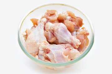 Fresh raw chicken wings (wingstick) in glass bowl on white background.