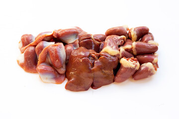Mixed chicken entrails in white plate on yellow background.