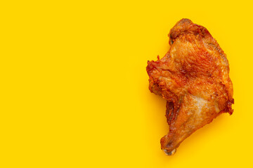 Fried chicken on yellow background.