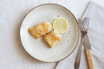 Fried fish with lemon. Minimalism