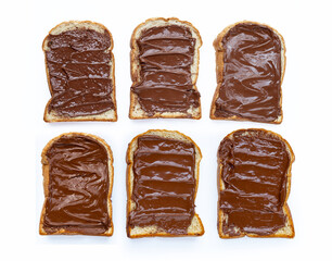 Bread with sweet chocolate cream and hazelnuts on white
