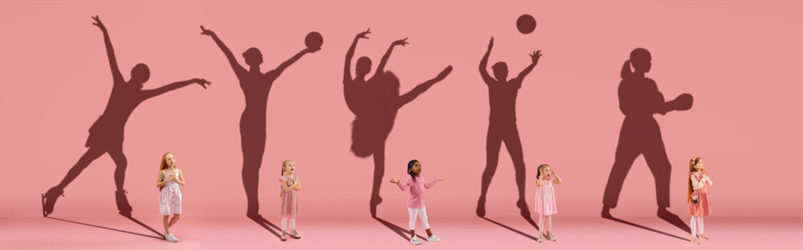 Collage. Dreams about big and famous future. Conceptual image with little girls and shadows of fit professional sportsmen on light pink, coral background