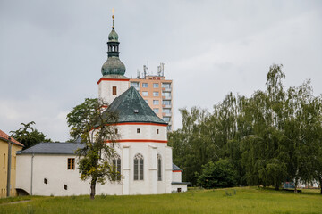 Krasne Brezno, Bohemia, Czech Republic, 26 June 2021:  Saxony style renaissance church of St. Florian with white tower and gothic windows, National cultural monument in summer day - obrazy, fototapety, plakaty