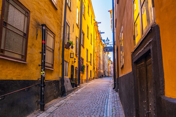 Stockholm, Sweden - July 5 2021: Pr¨¨¨ästgatan cobblestone alley in Stockholm Gamla Stan city centre, Sweden. Popular tourist destination