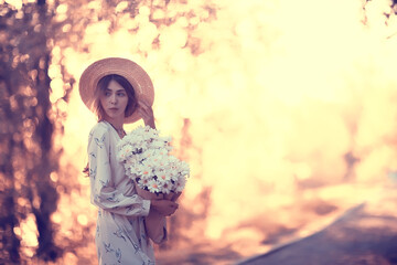 girl in a straw hat portrait spring freedom / concept spring view model happy people
