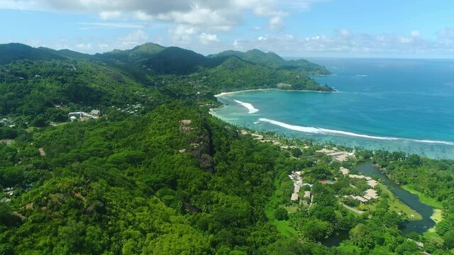 Video from a drone in the Seychelles, the drone flies high above Baie Lazare