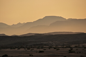 Fototapeta na wymiar incredible view of mountains in golden light during sunset