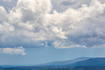Storm clouds over a mountain landscape