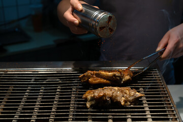 Delicious roast pig's feet. The chef is baking pig's feet