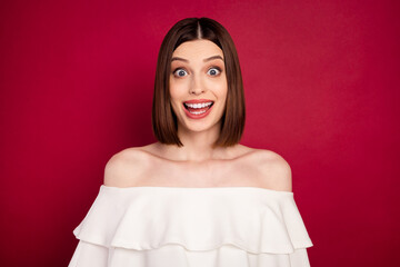 Photo of funny brown hairdo millennial lady wear white naked shoulders top isolated on red color...