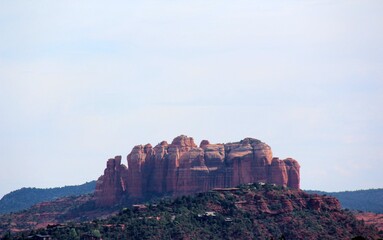 Skyline view of a set of rocky mountains in red color.