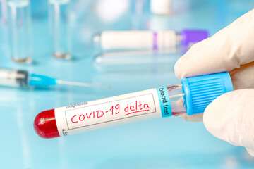 Doctor with a positive blood sample for the new variant detected of the coronavirus strain called...