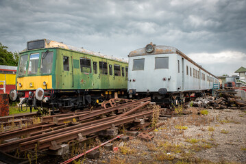 Abandoned vintage trains on an used railroad railway line. 