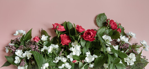 Close-up composition with fresh natural flowers top view.