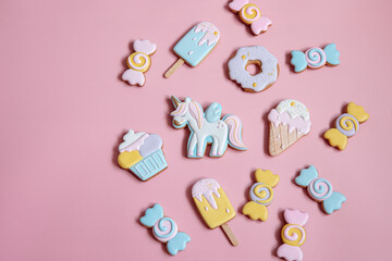 Colorful gingerbread cookies in colored glaze of different shapes.