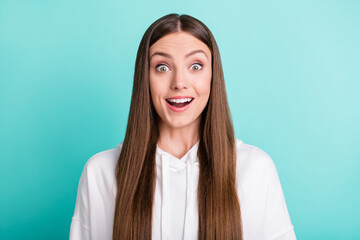 Photo of amazed young shocked woman reaction unexpected sale news isolated on teal color background