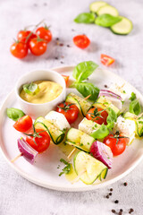 vegetarian salad with zucchini, tomato and basil