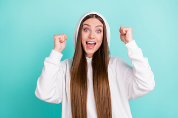 Portrait of attractive cheerful lucky long-haired girl rejoicing having fun isolated over bright...