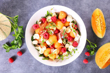 salad with melon, mozzarella and raspberry