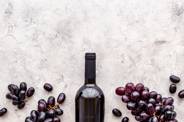 Red wine bottle with grapes. Top view