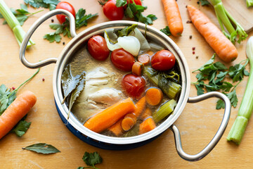 Homemade chicken broth with vegetables