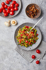 Quinoa with green beans, tomatoes, fried champignons, corn, red bell peppers, peas and soybeans. Healthy Vegetable Mix