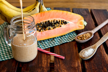 Banana and papaya smoothie with oatmeal and granola Healthy breakfast smoothie.