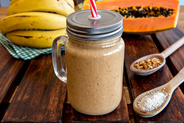 Banana and papaya smoothie with oatmeal and granola Healthy breakfast smoothie.