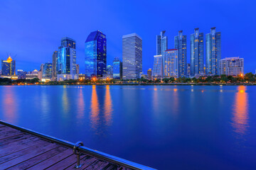 modern buildings of Bangkok night city skyline, Thailand. Cityscape photography of Benchakitti Park...
