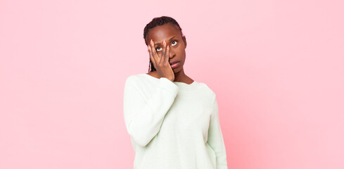 afro black adult woman feeling bored, frustrated and sleepy after a tiresome, dull and tedious...