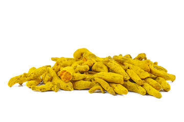 Pile of dried turmeric rhizomes on a white background