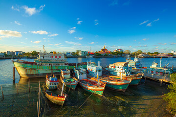 Fototapeta na wymiar Many boats moored in sunrise morning time at Chalong port, Main port for travel ship to krabi and phi phi island, Phuket, Thailand