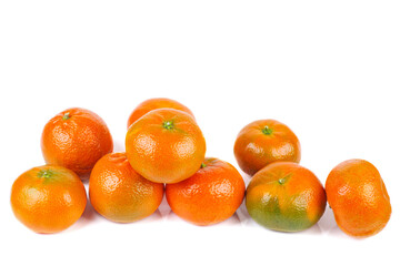Pile of ripe juicy orane (clemetine ) isolated on a white background