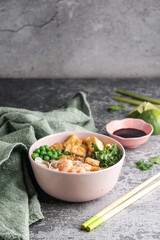 asian rice noodle soup with fried tofu and shrimps