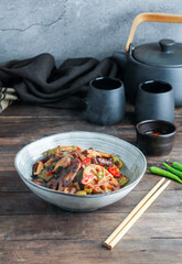 Lotus root or Rhizome stir-fry with Shiitake mushrooms, spices, hot peppers, dark soy sauce and green onions