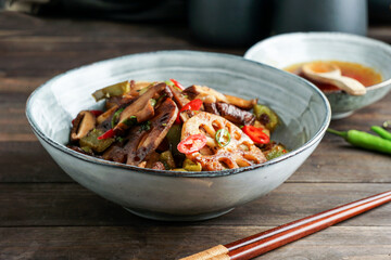 Lotus root or Rhizome stir-fry with Shiitake mushrooms, spices, hot peppers, dark soy sauce and green onions