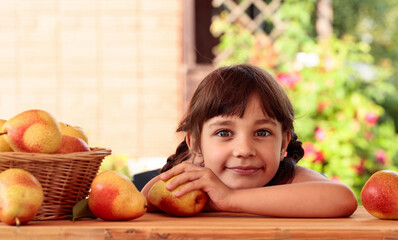 Cute little girl with pears.