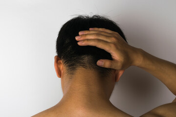 Fototapeta premium A person feeling a headache on a white background