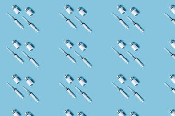 Syringe and vial with COVID-19 medicinal vaccine. Medical background as pattern.