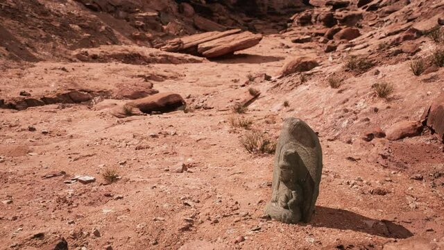 Ancient Statue on the Rocks Desert