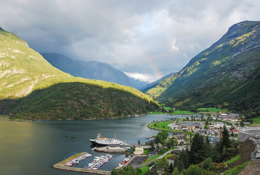 Rainbow over the village of Hellesylt by the fjord in Norway.