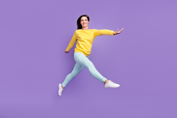 Fototapeta na wymiar Full length body size view of attractive cheerful carefree girl jumping walking isolated over violet purple color background