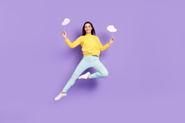 Fototapeta na wymiar Full length body size view of attractive cheerful girl jumping holding copy space cards isolated over violet purple color background