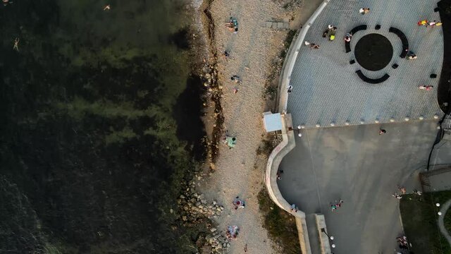 aerial video filming of waves over a wild beach. evening Black Sea in summer.