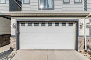 Exterior of a garage of a house with stone bricks walls and windows
