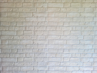 Modern house walls without plaster to show the cement and brick inside painted white.