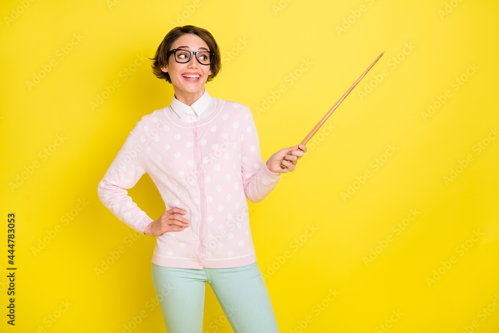 Poster photo portrait of curious funny girl in glasses pointing at school teaching looking empty space isol