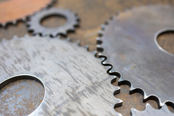 gears of different sizes on a metal surface