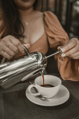 Cup of coffee on table in cafe. Morning coffee, drinking hot coffee and enjoying morning